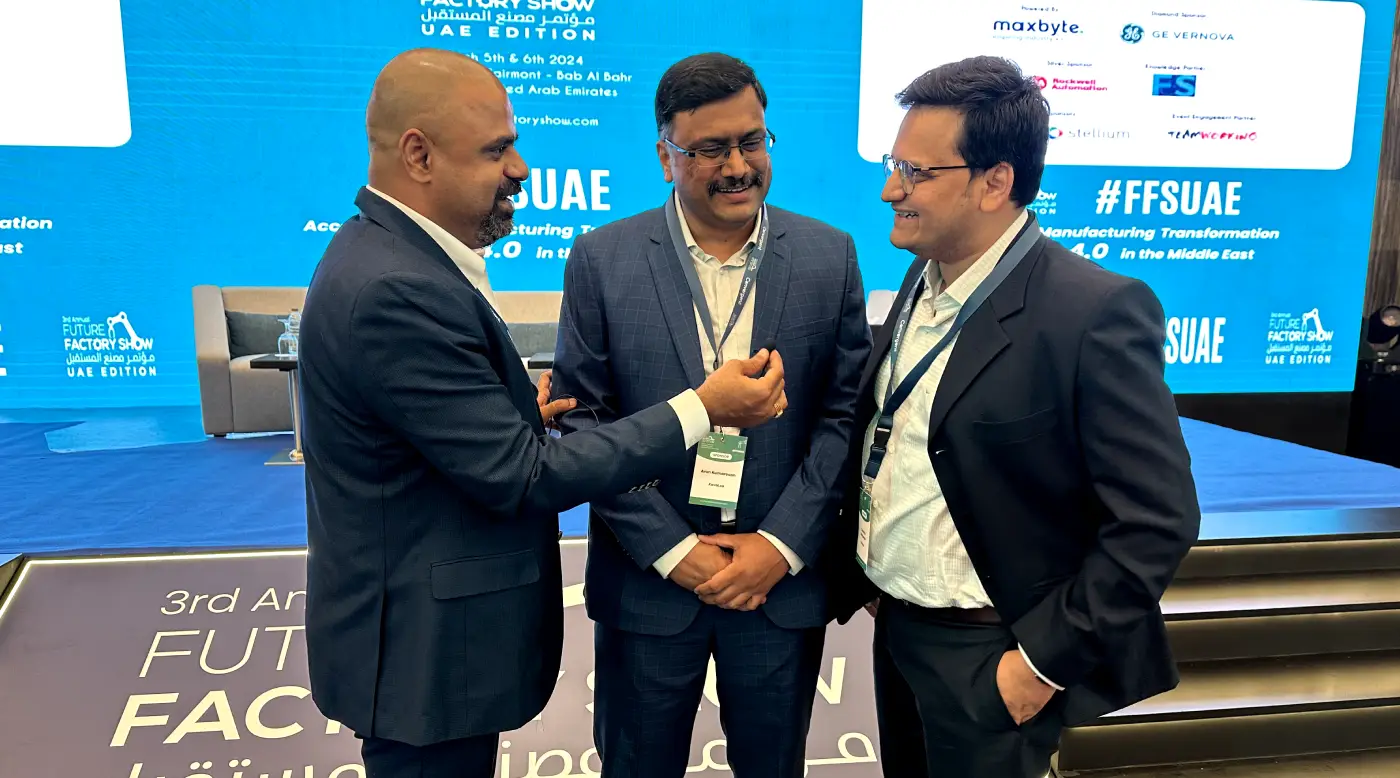 Maran in conversation with two delegates at the Future Factory Show in the UAE