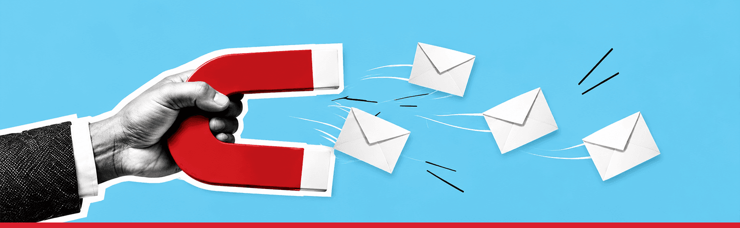 A hand holding a red magnet that pulls white envelopes towards it across a blue ground